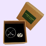 Bassin and Brown Crossed Hockey Sticks Lapel Pin - Black and White